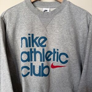 Nike Gray Crewneck Sweatshirt with Blue 'nike athletic club' Logo and Red Swoosh